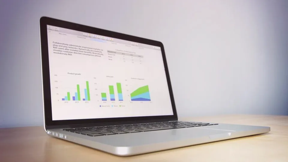 Laptop showing portfolio charts - tracking P2P interest and repayments in an investor dashboard