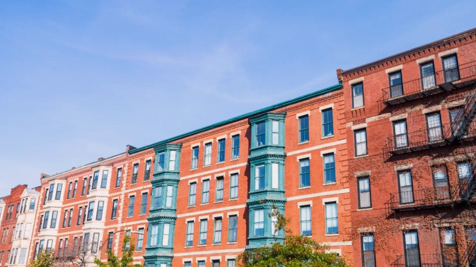 Row of city apartment buildings - real estate P2P investing